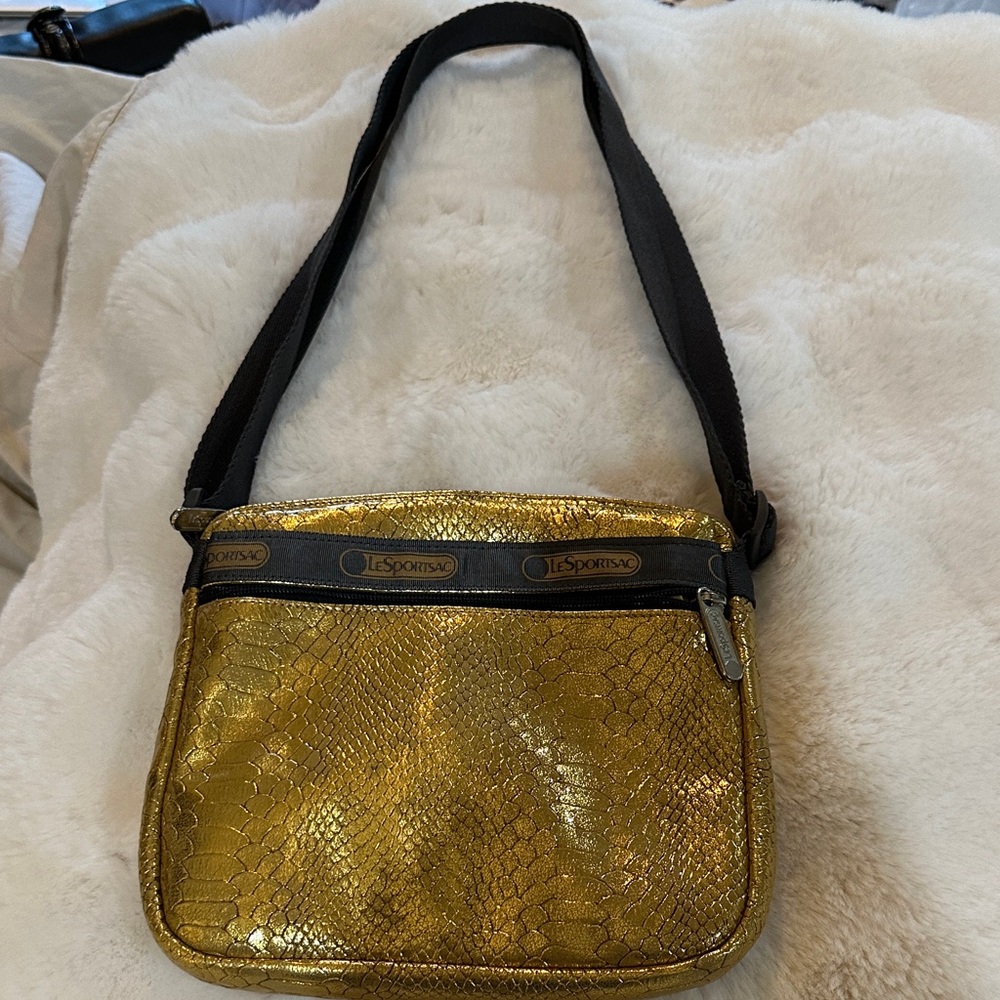 Lesportsac Metallic Gold Snake-Embossed Crossbody Bag with Adjustable Strap.